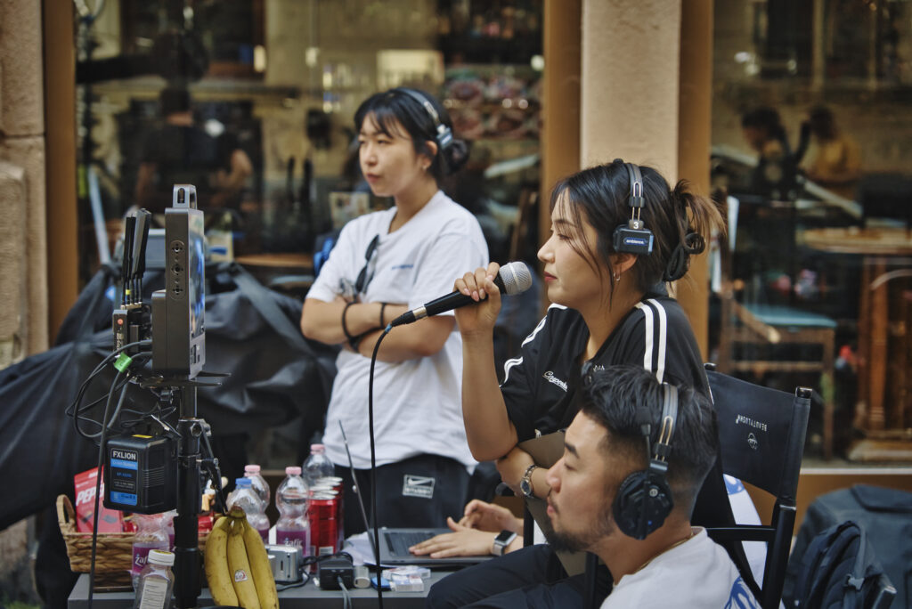 K-pop music video shoot in Budapest - Director with the production heads.